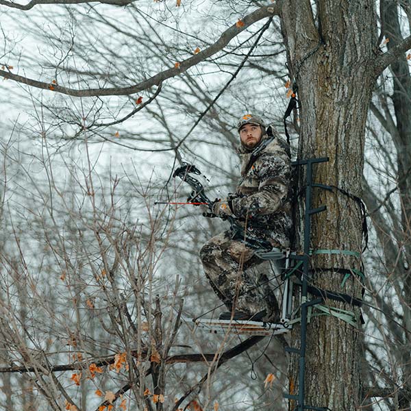 Man sitting in the tree stand wearing Scentloks BE1 Fortress